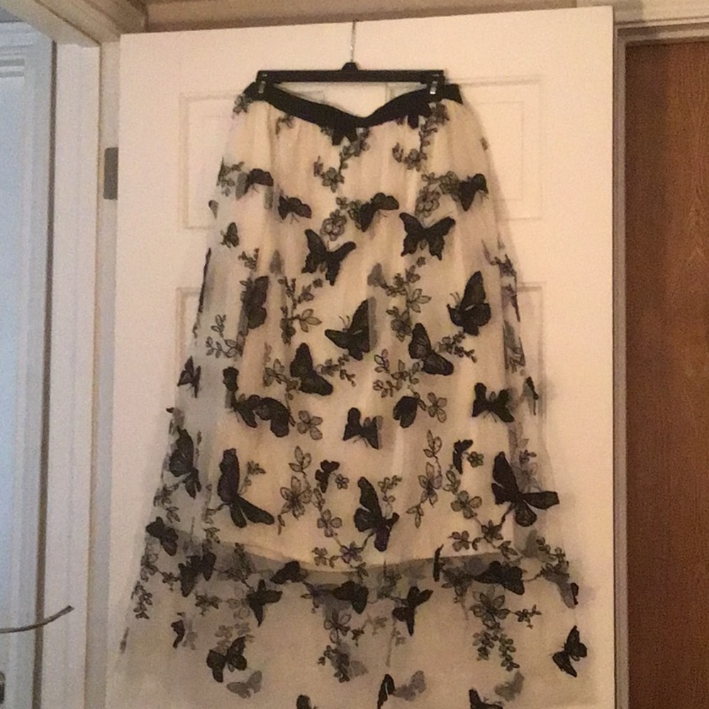 Black Butterflies with a Cream background.